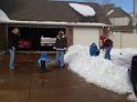 Josh in driveway and snowman building